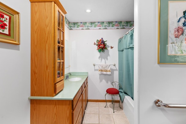 bathroom with tile patterned flooring, vanity, and shower / bath combo with shower curtain