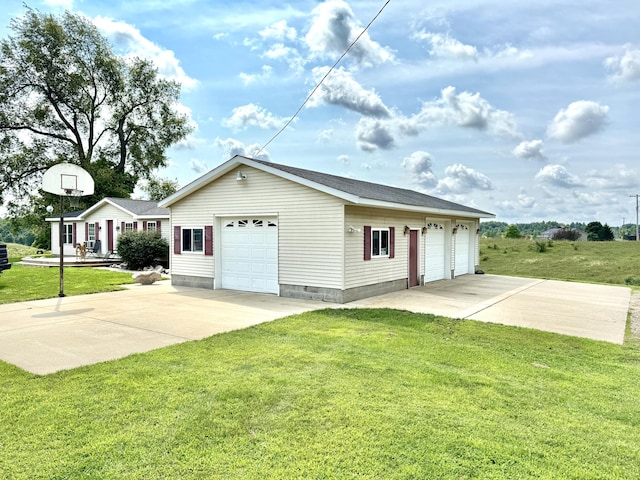 single story home with a garage, an outdoor structure, and a front lawn