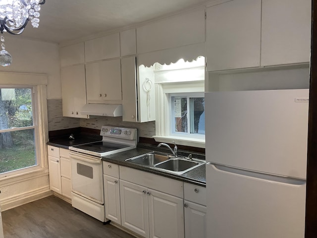 kitchen featuring tasteful backsplash, sink, white cabinets, dark hardwood / wood-style flooring, and white appliances