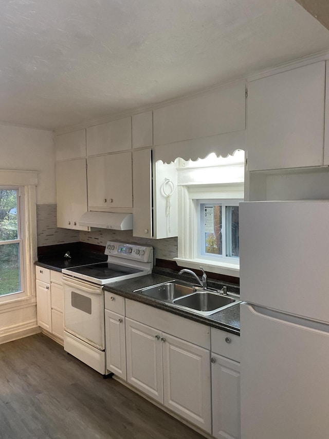 kitchen with dark wood-type flooring, sink, white cabinetry, tasteful backsplash, and white appliances