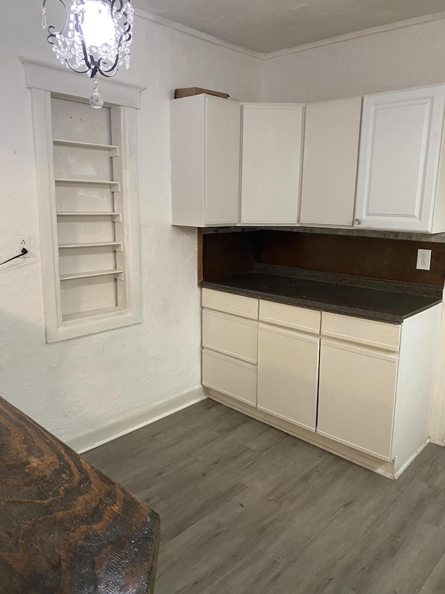 kitchen featuring white cabinets and dark hardwood / wood-style flooring