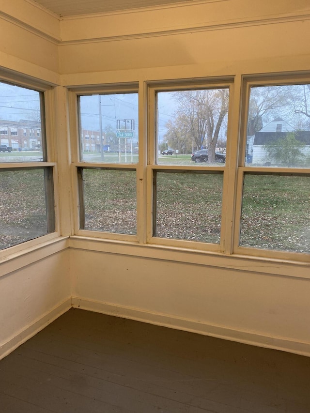 unfurnished sunroom featuring a healthy amount of sunlight