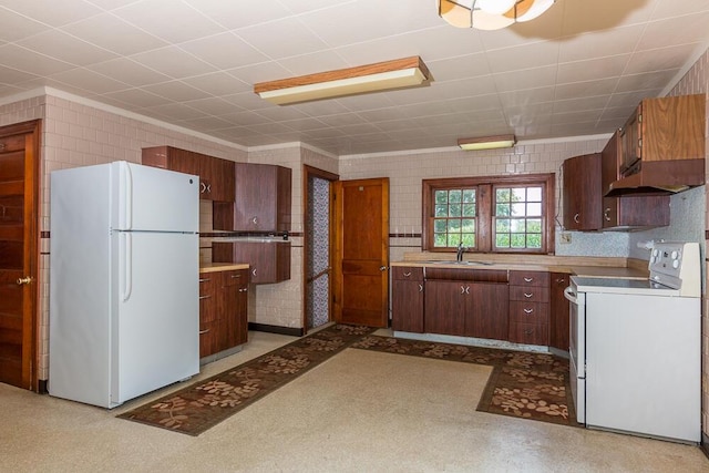 kitchen with sink and white appliances