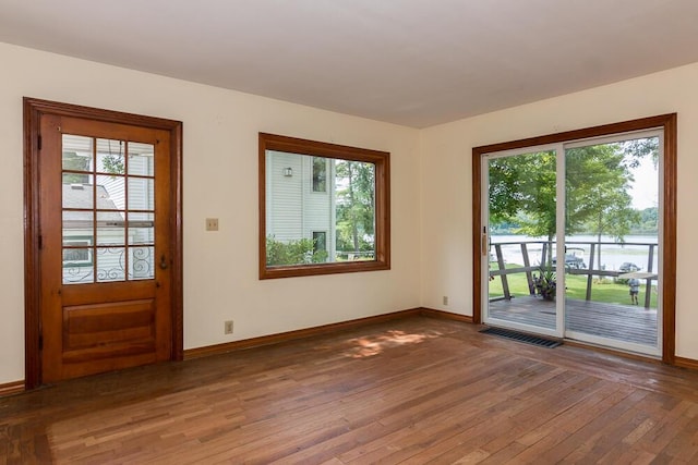 doorway with hardwood / wood-style flooring