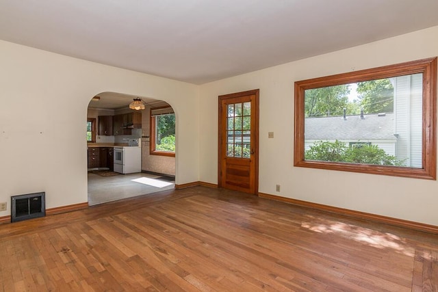 unfurnished living room featuring wood-type flooring