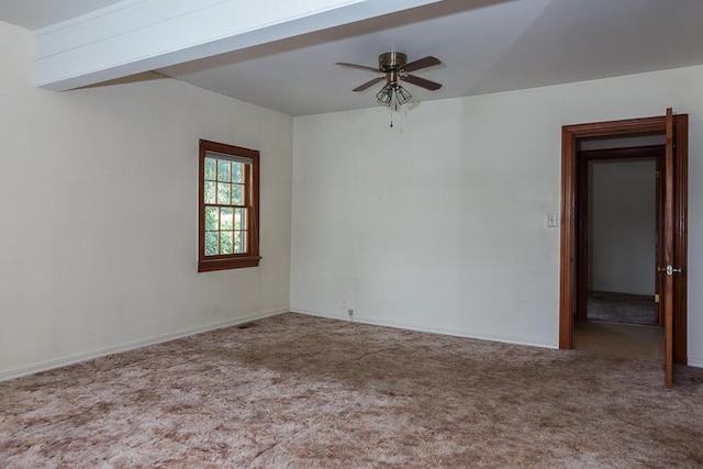 carpeted spare room featuring ceiling fan