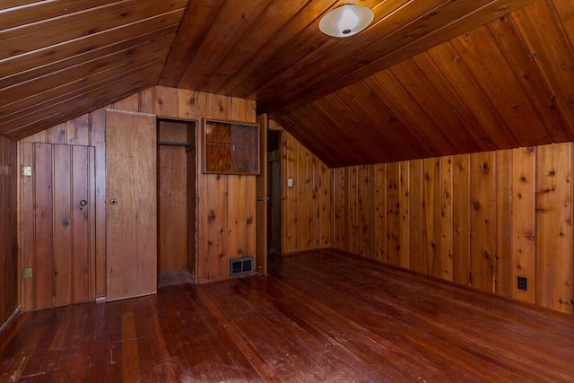 bonus room with dark hardwood / wood-style flooring, wood ceiling, vaulted ceiling, and wooden walls