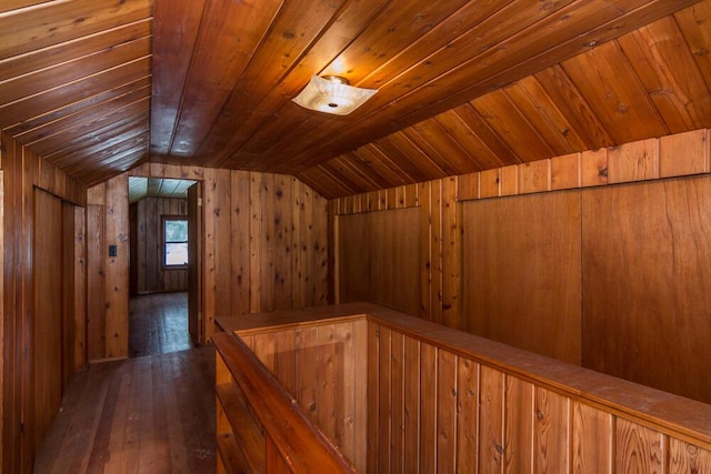 additional living space with wood ceiling, lofted ceiling, and dark hardwood / wood-style flooring