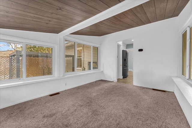 unfurnished sunroom featuring wood ceiling