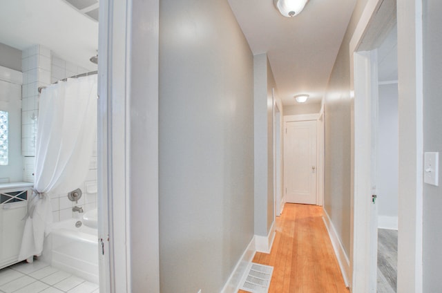 corridor featuring light hardwood / wood-style floors