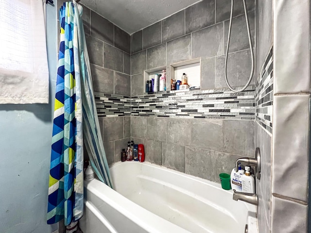 bathroom with shower / tub combo