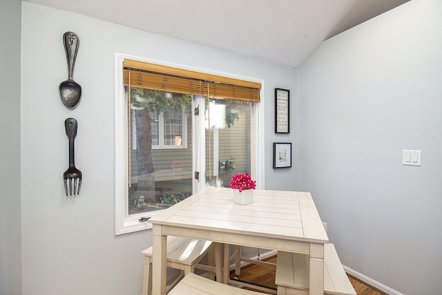 dining room featuring vaulted ceiling