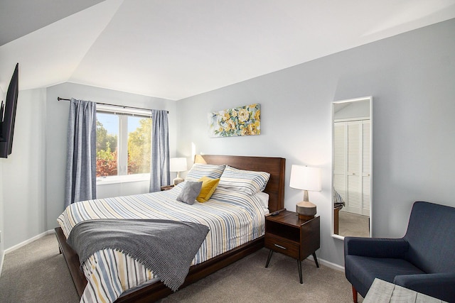 carpeted bedroom featuring vaulted ceiling