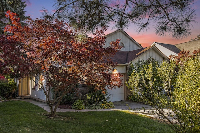 obstructed view of property featuring a yard