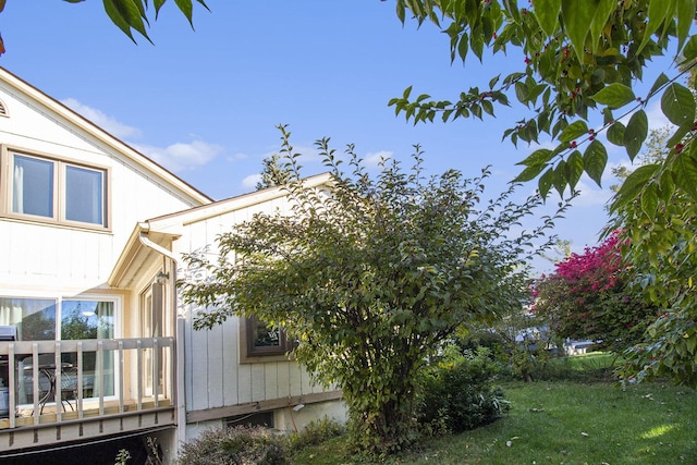 view of side of home featuring a yard