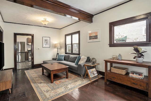 living room with ornamental molding, dark hardwood / wood-style floors, and beam ceiling