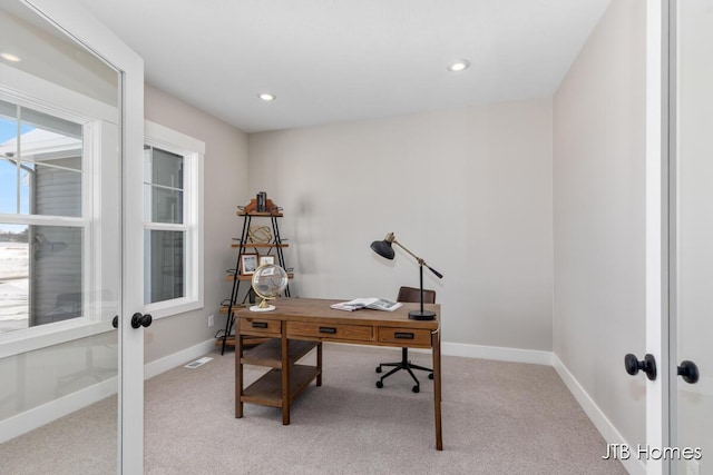 office space with french doors, light colored carpet, and baseboards