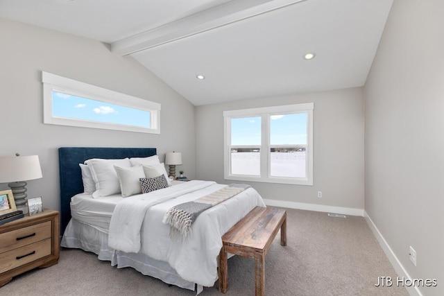 bedroom featuring light colored carpet, multiple windows, vaulted ceiling with beams, and baseboards