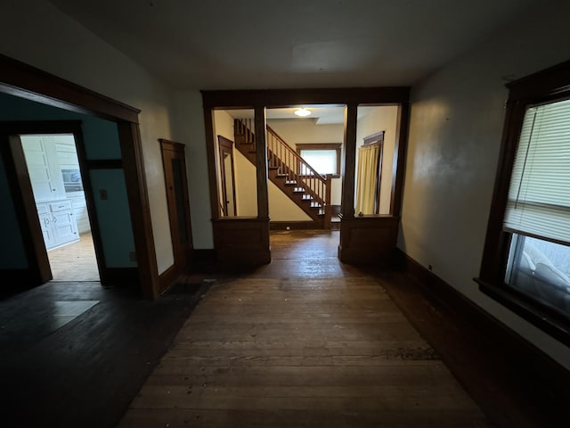 hall with dark wood-type flooring