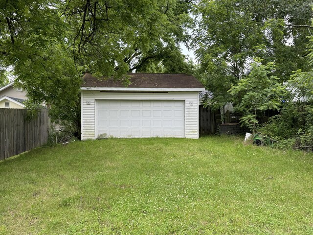 garage featuring a lawn