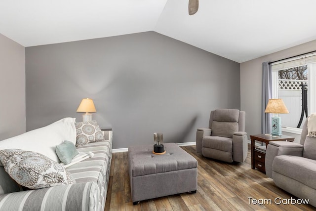 living room featuring hardwood / wood-style flooring, lofted ceiling, and ceiling fan