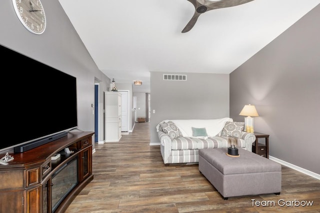 living room with ceiling fan and wood-type flooring