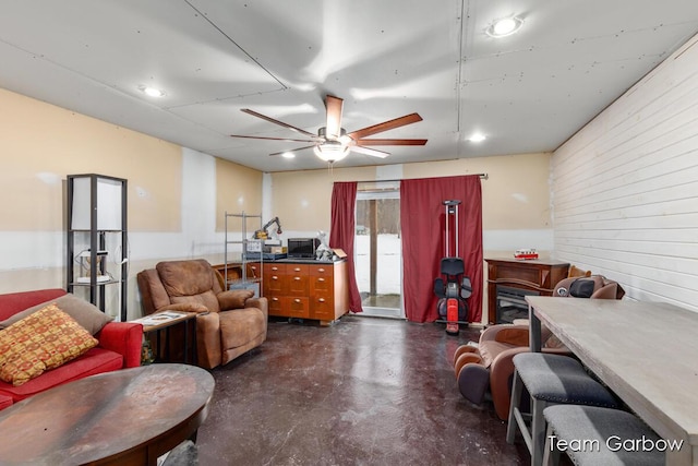 interior space with ceiling fan