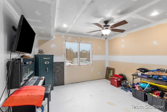 misc room with ceiling fan and concrete floors