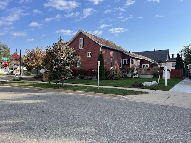 view of home's exterior with a lawn