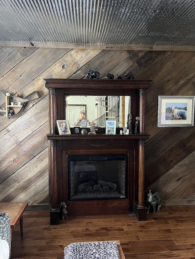 bar featuring wood-type flooring and wood walls