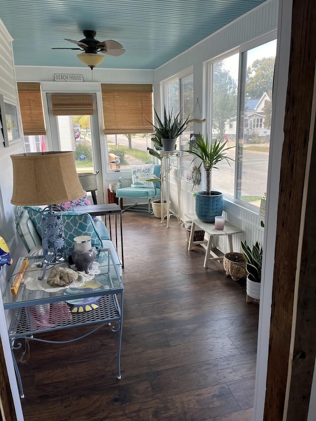 sunroom featuring ceiling fan