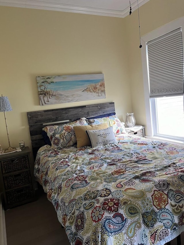 bedroom featuring crown molding