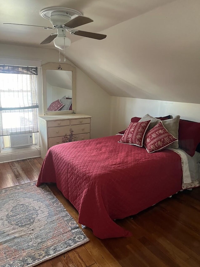 bedroom with vaulted ceiling, ceiling fan, and dark hardwood / wood-style flooring