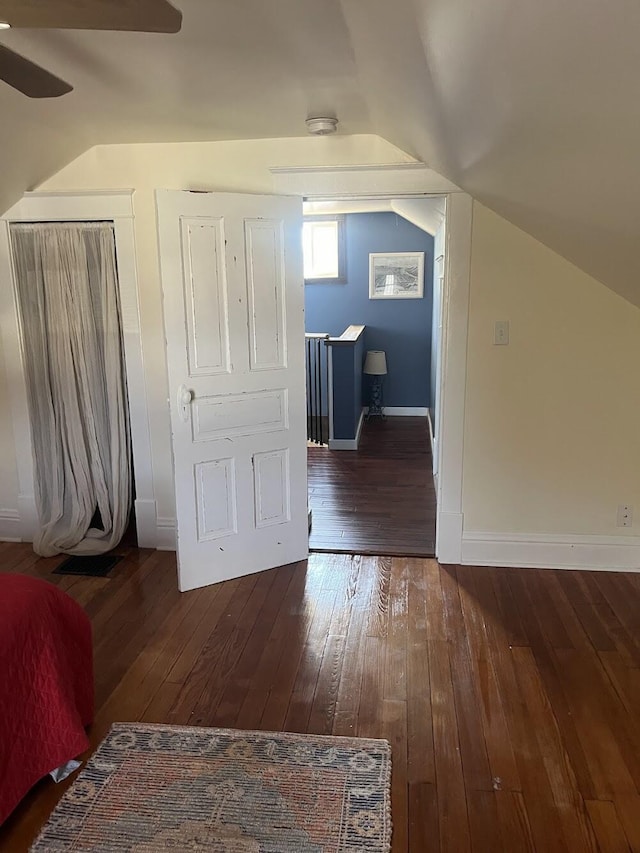 bonus room featuring lofted ceiling, dark wood-type flooring, and ceiling fan