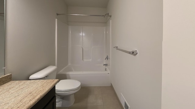 full bathroom featuring tile patterned floors, toilet, shower / washtub combination, and vanity