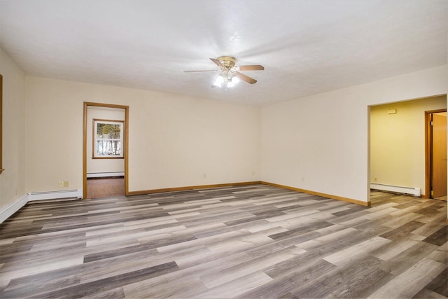 empty room with a baseboard radiator, ceiling fan, and light wood-type flooring