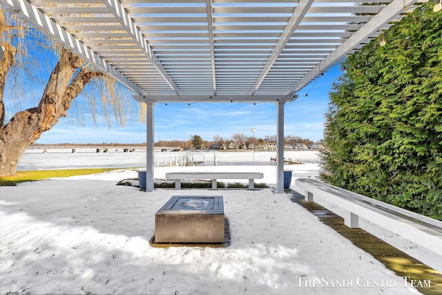 view of patio / terrace with a fire pit and a pergola