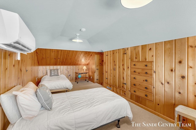 carpeted bedroom with lofted ceiling, an AC wall unit, and wood walls