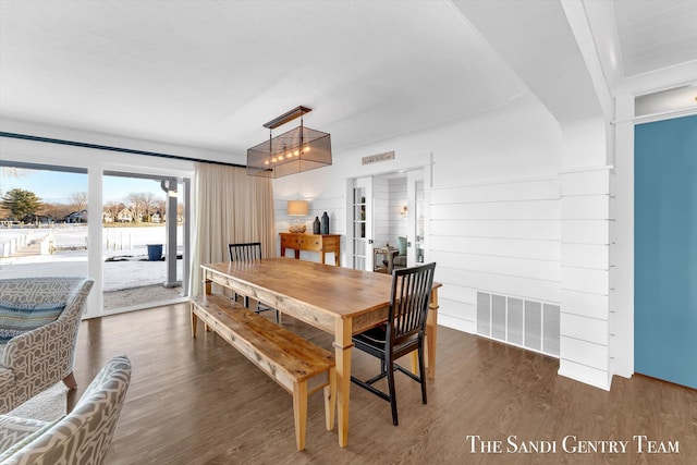 dining area featuring visible vents and wood finished floors