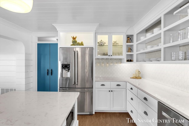 kitchen featuring dark wood finished floors, stainless steel refrigerator with ice dispenser, open shelves, white cabinets, and light stone countertops