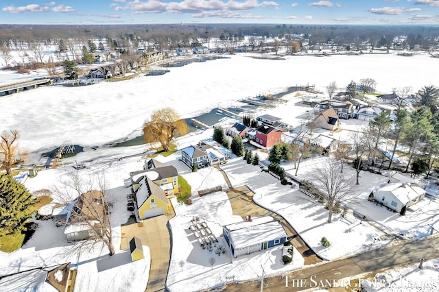 snowy aerial view with a residential view