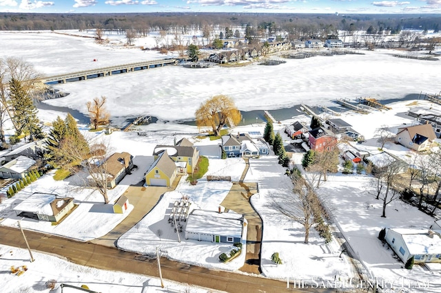 snowy aerial view with a residential view