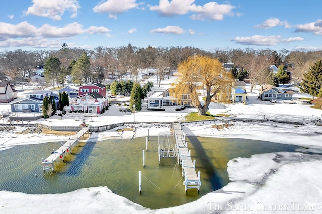 view of dock with a water view and a residential view