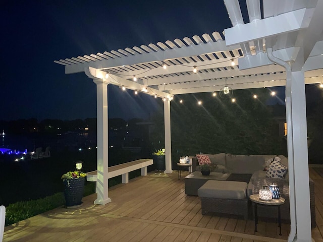 deck at twilight featuring outdoor lounge area and a pergola