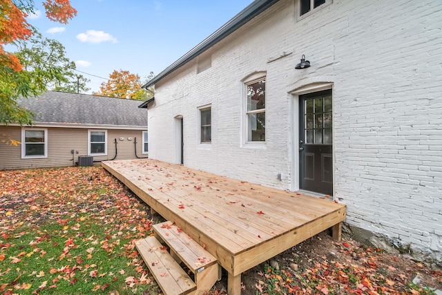 wooden terrace featuring central AC unit