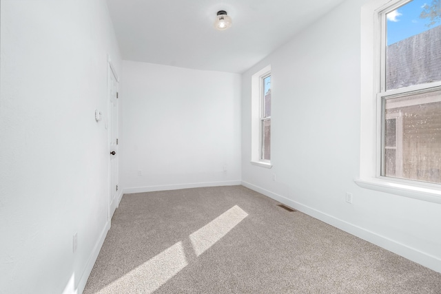 unfurnished room with carpet