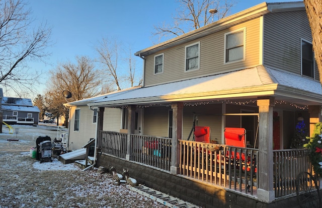 farmhouse featuring covered porch