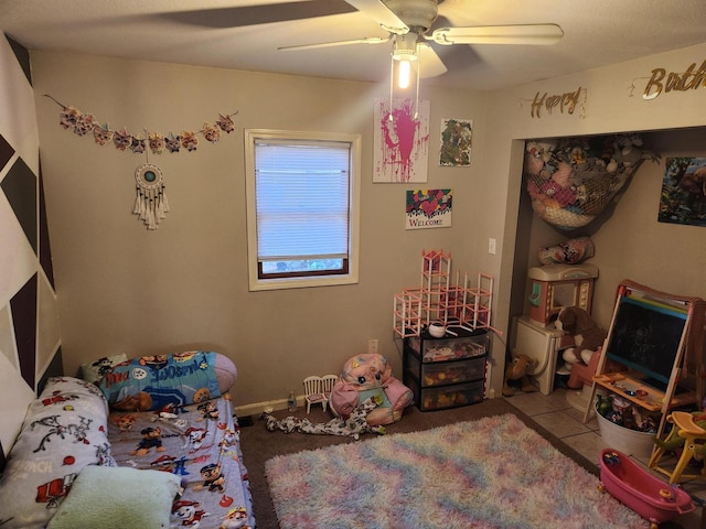 bedroom featuring tile patterned floors and ceiling fan