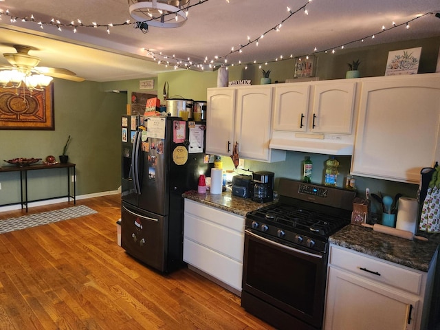 kitchen featuring white cabinetry, light hardwood / wood-style flooring, and black appliances