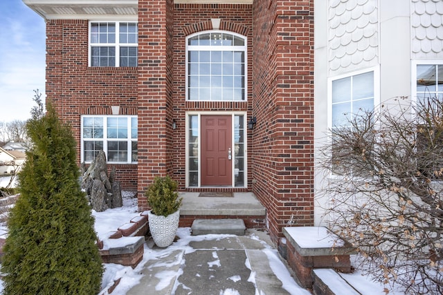 view of snow covered property entrance